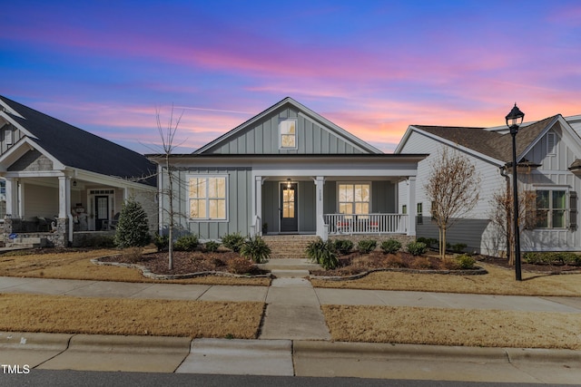 view of front of property featuring board and batten siding and covered porch