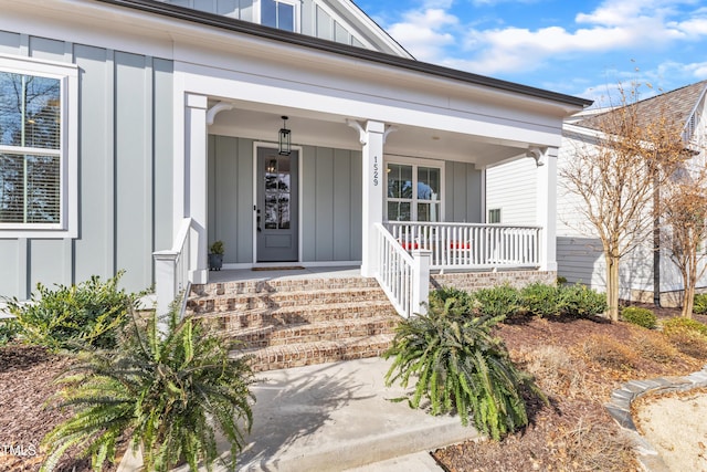 property entrance with a porch and board and batten siding