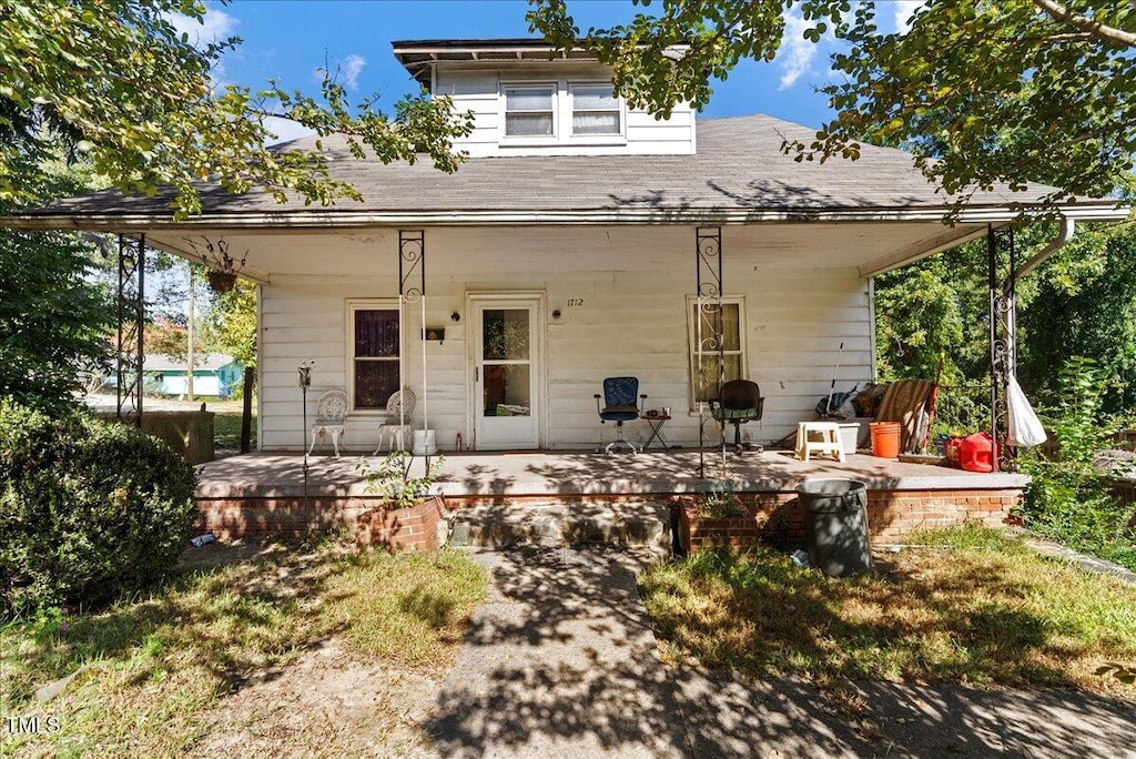 back of house featuring a wooden deck