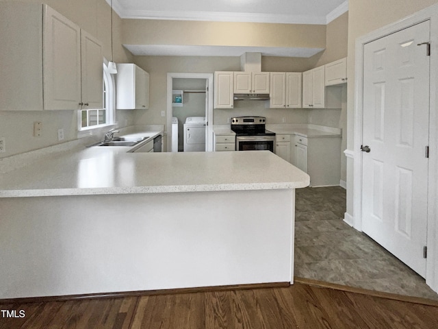 kitchen featuring washing machine and dryer, stainless steel electric range oven, white cabinets, and kitchen peninsula