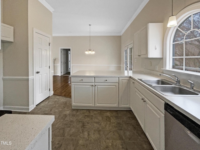 kitchen with hanging light fixtures, stainless steel dishwasher, and white cabinets