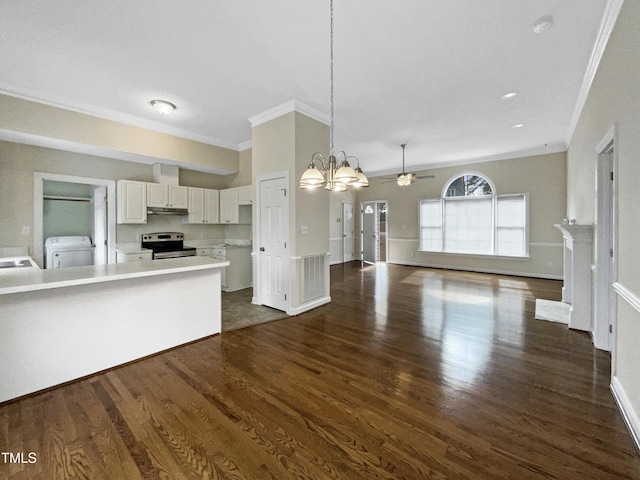 kitchen with dark wood-type flooring, washer / dryer, decorative light fixtures, electric range, and white cabinets