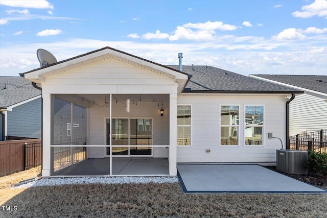 rear view of property with central AC, a sunroom, and a patio