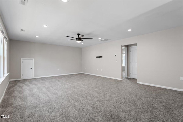 empty room featuring carpet floors and ceiling fan