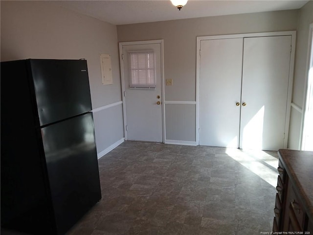 kitchen featuring black fridge