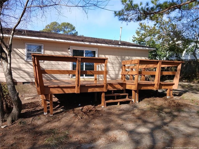 rear view of house with a wooden deck