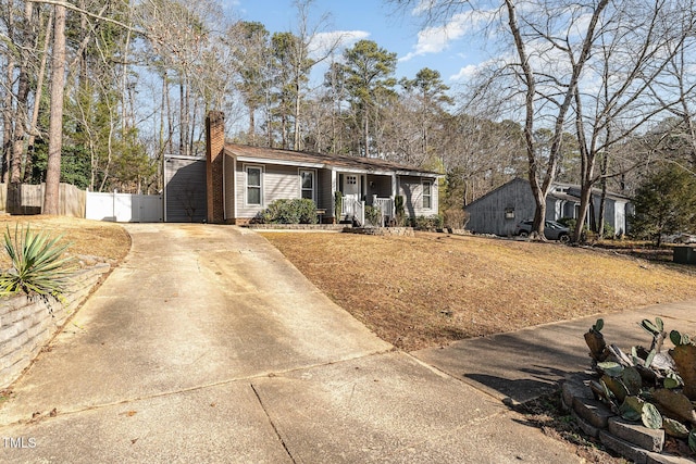 ranch-style home featuring covered porch