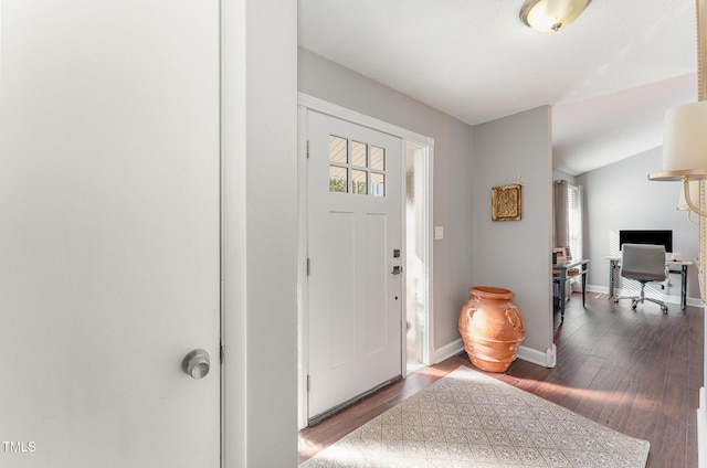 foyer entrance featuring hardwood / wood-style flooring and lofted ceiling