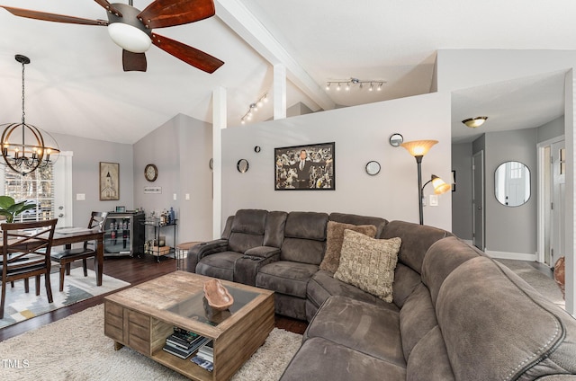 living room featuring wood-type flooring, ceiling fan with notable chandelier, and vaulted ceiling with beams