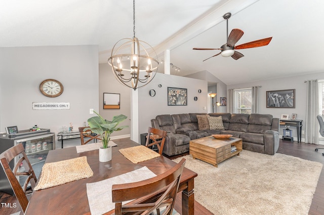 dining room with wood-type flooring, high vaulted ceiling, ceiling fan with notable chandelier, and beam ceiling