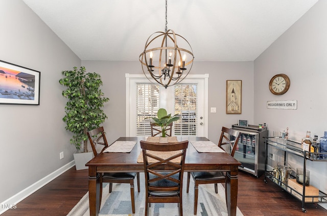 dining room with an inviting chandelier, dark hardwood / wood-style floors, and beverage cooler