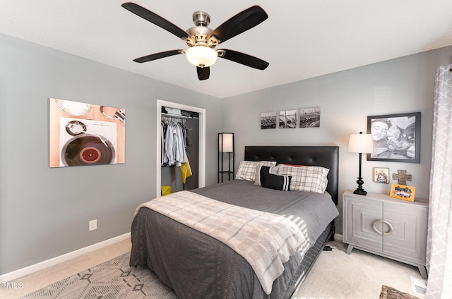 bedroom with light carpet, a closet, and ceiling fan