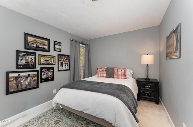 bedroom featuring light carpet