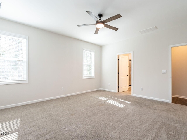 empty room with light carpet and ceiling fan