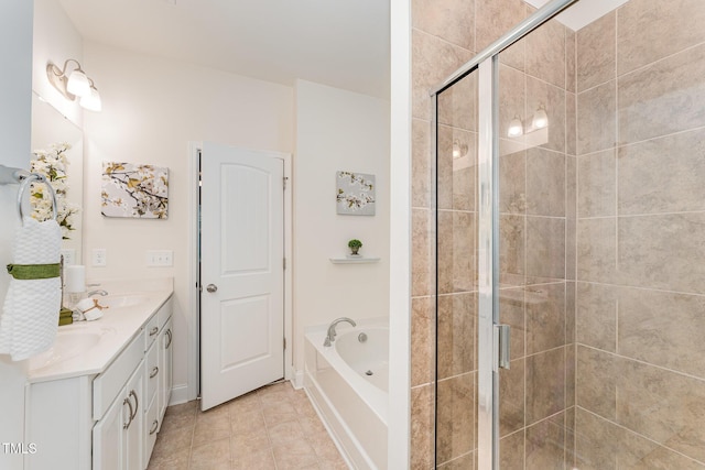 bathroom with vanity, tile patterned floors, and plus walk in shower