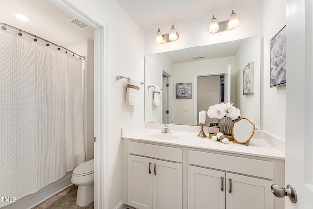 full bathroom featuring vanity, shower / bath combo, tile patterned floors, and toilet