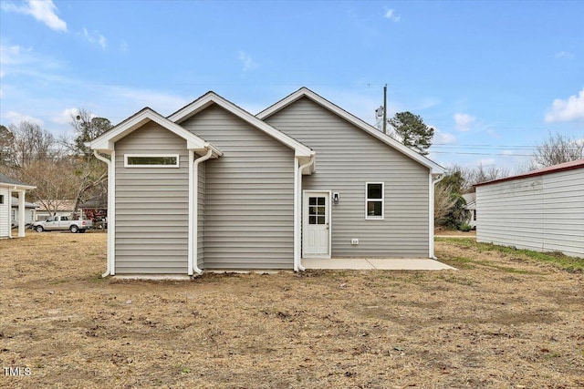 back of property featuring a patio area