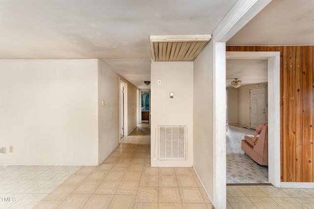 hallway with wooden walls