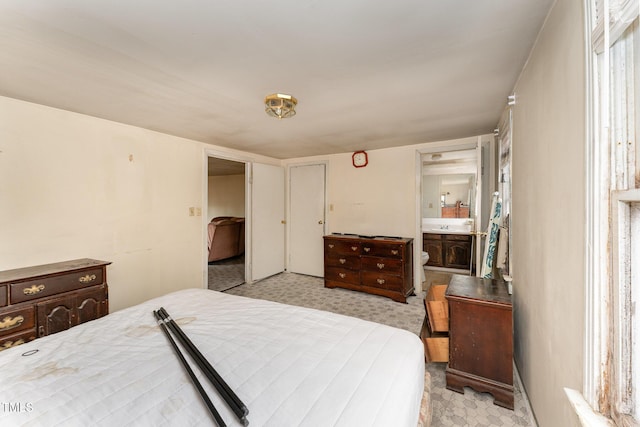 bedroom featuring connected bathroom