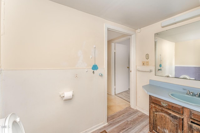 bathroom featuring vanity and wood-type flooring