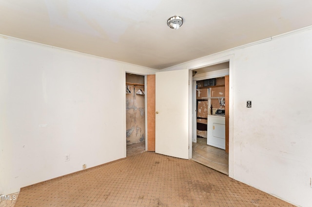 unfurnished room featuring washer / clothes dryer