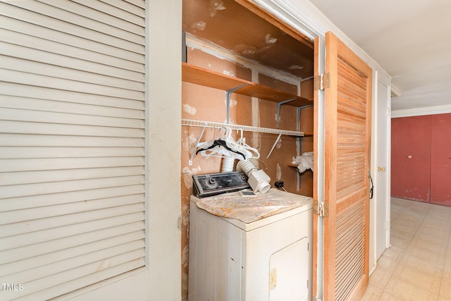 laundry room featuring washer / dryer