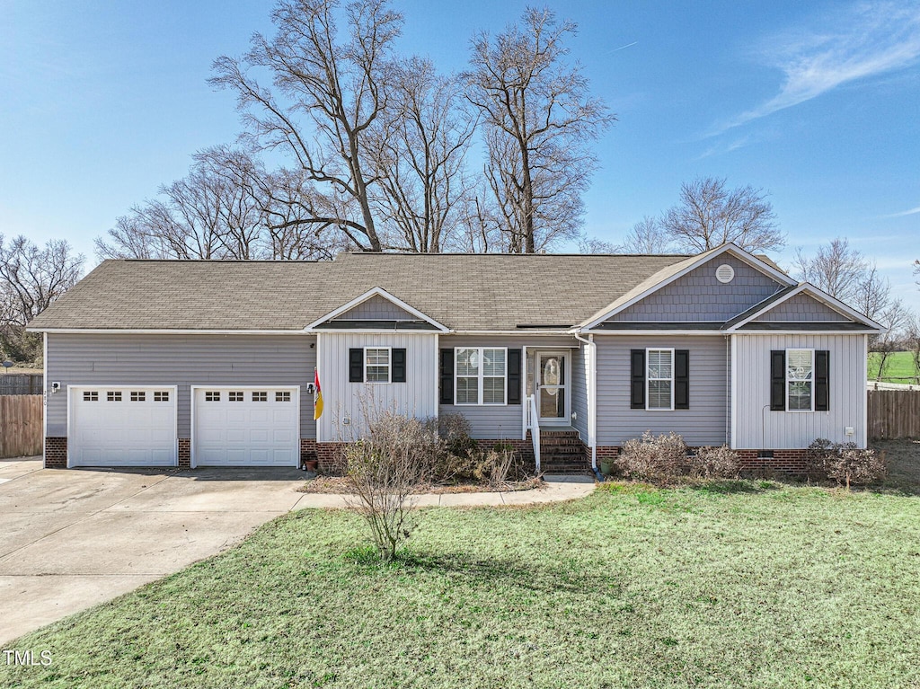 ranch-style house with a garage and a front yard