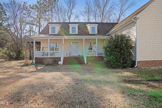 view of front facade featuring a front yard and covered porch