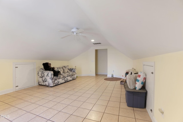 bonus room with lofted ceiling, light tile patterned floors, and ceiling fan