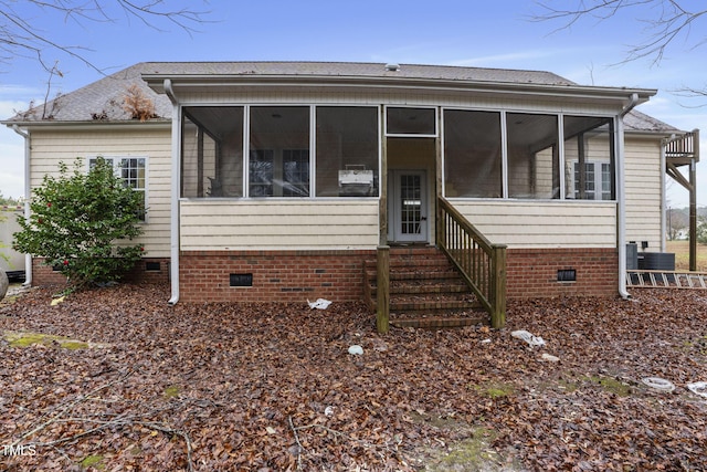 view of front of house with a sunroom and cooling unit