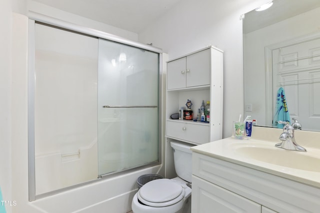 full bathroom featuring enclosed tub / shower combo, vanity, and toilet