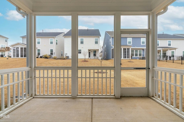 sunroom / solarium featuring a healthy amount of sunlight