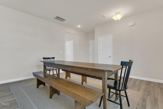 dining area featuring visible vents, recessed lighting, baseboards, and wood finished floors