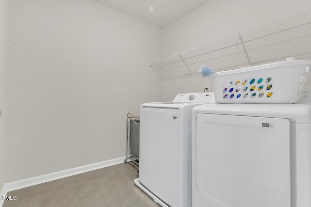 laundry room featuring tile patterned flooring and independent washer and dryer