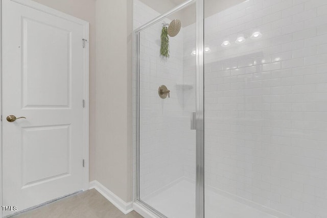 bathroom featuring tile patterned floors and walk in shower