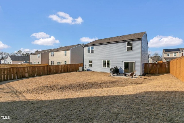 rear view of property featuring a patio area and a lawn