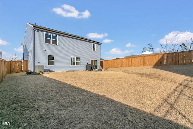 rear view of house featuring cooling unit