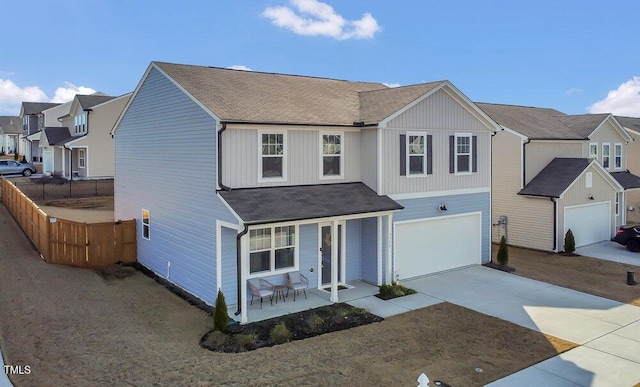 view of front property featuring a garage and a porch