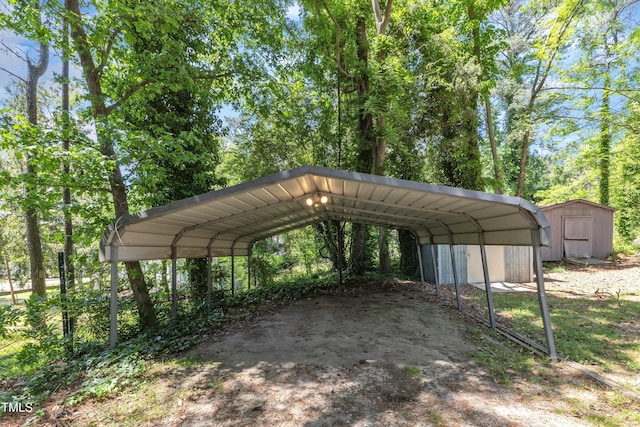 view of car parking with a shed and a detached carport