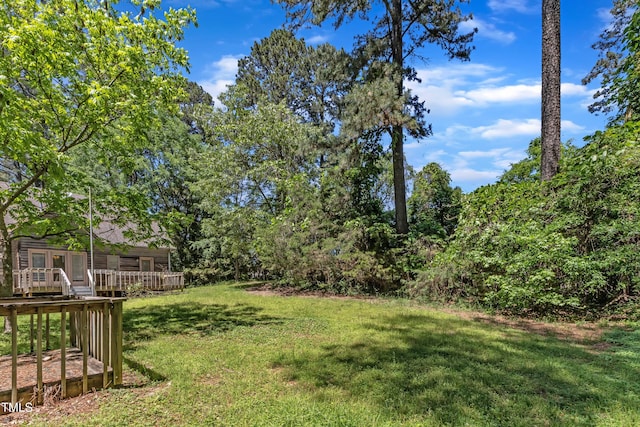 view of yard with a deck