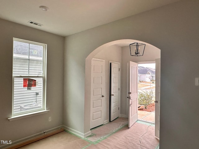 view of carpeted entrance foyer