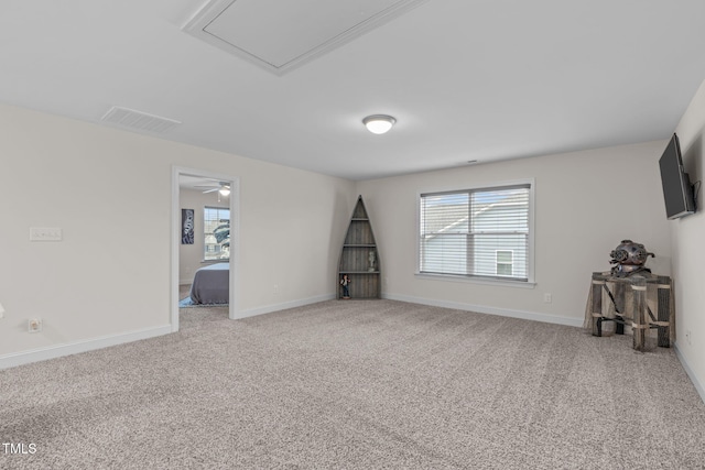 carpeted empty room with baseboards and visible vents