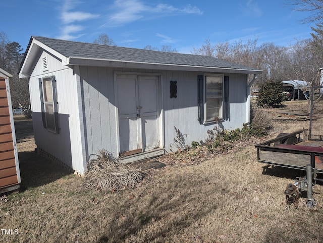 exterior space featuring a shed and a front lawn