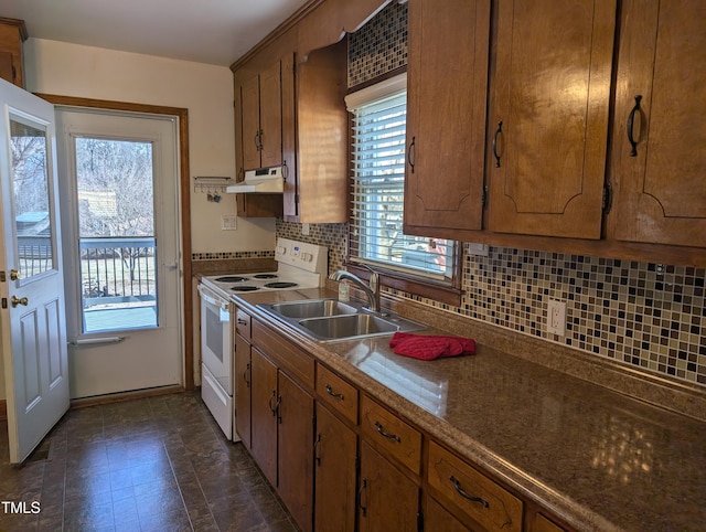 kitchen with tasteful backsplash, sink, and white electric range oven