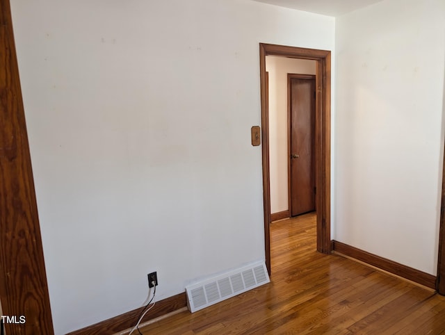 unfurnished room featuring hardwood / wood-style floors