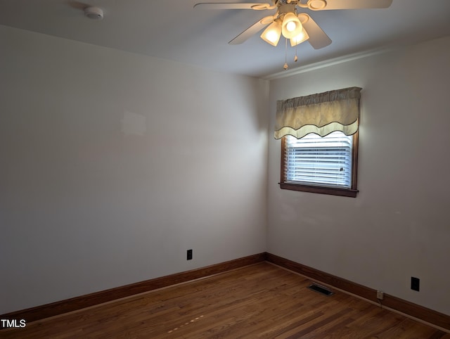 unfurnished room with ceiling fan and hardwood / wood-style floors