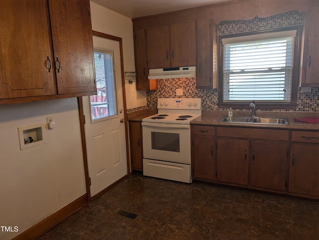 kitchen with tasteful backsplash, white electric stove, and sink