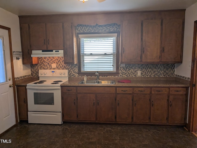 kitchen with tasteful backsplash, sink, and white range with electric cooktop