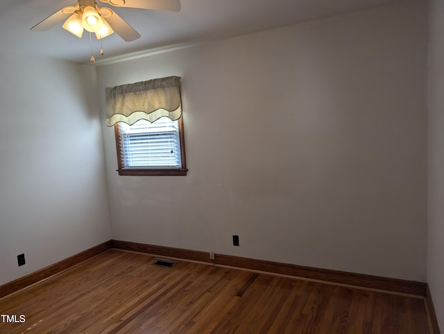 empty room with wood-type flooring and ceiling fan