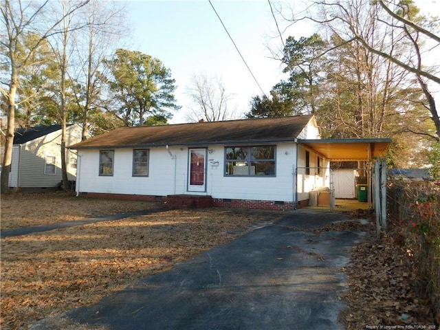 view of front of home featuring a carport